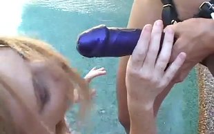 Obedient redhead is forced to lick and suck a huge strapon