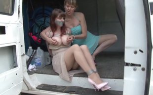 Incredibly busty and sexy babe is getting kidnaped by a lesbian