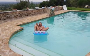 Flexible and totally naked bitch is swimming and masturbating