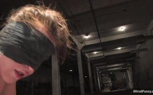 Two guys are blindfolding one slutty lesbian and fucking all holes