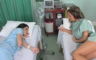 Two extremely busty and horny babes are meting in hospital