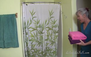 Sexy old lady is licking out her young bitch under the shower